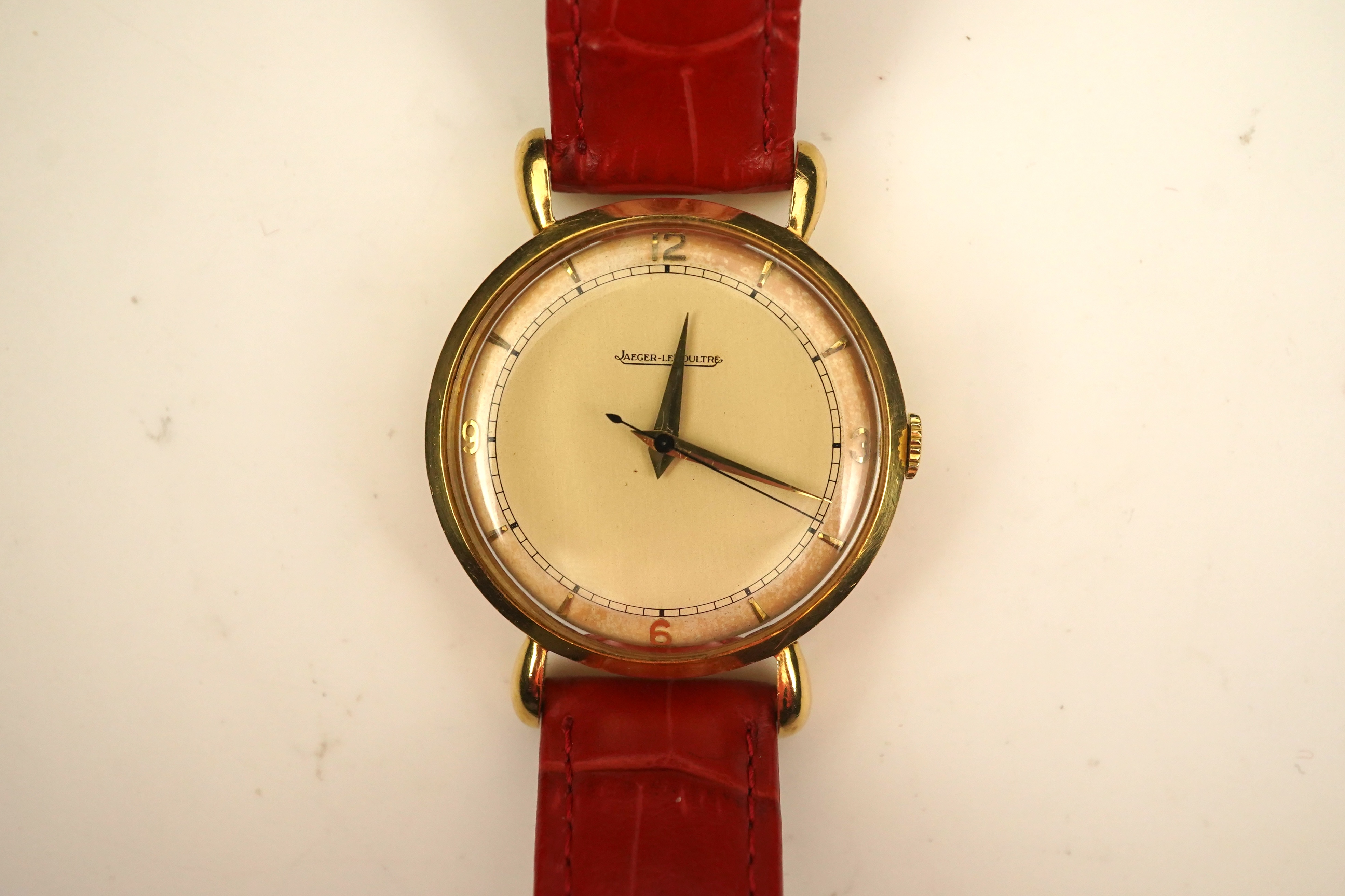 A gentleman's 1950's 18ct gold Jaeger LeCoultre manual wind wrist watch, on a later associated leather strap